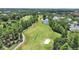 Scenic aerial view of a beautiful golf course with lush greenery, mature trees, and serene ponds at 14205 Cypress Ter, Tampa, FL 33618