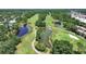 Wide view showcases a golf course with multiple ponds, mature trees, and lush green fairways at 14205 Cypress Ter, Tampa, FL 33618
