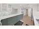 Well lit modern kitchen featuring gray cabinets, stone countertops, and stainless steel appliances at 14205 Cypress Ter, Tampa, FL 33618