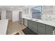 Modern kitchen featuring stainless steel appliances, gray cabinets and stone countertops at 14205 Cypress Ter, Tampa, FL 33618