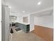 Kitchen featuring stainless steel appliances and gray cabinets opening to another room at 14205 Cypress Ter, Tampa, FL 33618