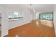 Bright open-concept floor plan that connects the kitchen and living areas, filled with natural light at 14205 Cypress Ter, Tampa, FL 33618