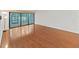 Spacious living room featuring sleek laminate flooring and sliding glass doors to the outside at 14205 Cypress Ter, Tampa, FL 33618