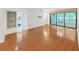 Bright living room with laminate flooring, leading to exterior patio through sliding glass doors at 14205 Cypress Ter, Tampa, FL 33618
