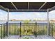 Covered balcony boasting panoramic water views, perfect for relaxing and entertaining at 1476 Harbour Walk Rd, Tampa, FL 33602