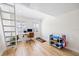 Bright bedroom with wood floors, ladder access to loft, home office and workout area at 1476 Harbour Walk Rd, Tampa, FL 33602