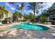 Enjoy the community pool, surrounded by lush landscaping and comfortable lounge areas at 1476 Harbour Walk Rd, Tampa, FL 33602