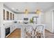 Bright kitchen features white cabinetry, marble countertops, and a stylish island with seating at 1476 Harbour Walk Rd, Tampa, FL 33602