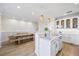 Open-concept kitchen and dining room with island seating and modern fixtures and finishes at 1476 Harbour Walk Rd, Tampa, FL 33602