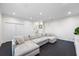 Spacious living room features recessed lighting, dark wood floors, and a large comfortable couch at 1476 Harbour Walk Rd, Tampa, FL 33602