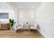 Sitting area with hardwood floors, white walls, stylish furnishings, and recessed lighting at 1476 Harbour Walk Rd, Tampa, FL 33602