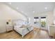 Bright bedroom features wood floors, a balcony with water views, and plenty of natural light at 1476 Harbour Walk Rd, Tampa, FL 33602