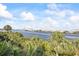 Enjoy picturesque water views from this condo complex surrounded by lush palm trees at 1476 Harbour Walk Rd, Tampa, FL 33602