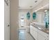 Bathroom boasts stylish vanity with granite countertop and decorative coastal accents, adding a touch of elegance at 15428 Atwater Dr, Brooksville, FL 34604