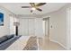 Bright bedroom featuring a large closet, neutral paint, and a ceiling fan for added comfort and style at 15428 Atwater Dr, Brooksville, FL 34604