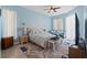 Comfortable bedroom with natural light, ceiling fan and decorative rug at 15428 Atwater Dr, Brooksville, FL 34604