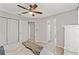 This is a comfortable bedroom offering ceiling fan and an attached bathroom entrance at 15428 Atwater Dr, Brooksville, FL 34604