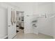 Walk-in closet with wire shelving, open doorway, and access to the bathroom at 15428 Atwater Dr, Brooksville, FL 34604