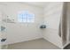 Walk-in closet with wire shelving and a large window at 15428 Atwater Dr, Brooksville, FL 34604