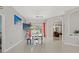 Bright dining area with tile floors, open to the living spaces, filled with natural light and modern furnishings at 15428 Atwater Dr, Brooksville, FL 34604