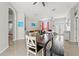 Bright and open dining room showcases a long table and bench seating, perfect for entertaining at 15428 Atwater Dr, Brooksville, FL 34604