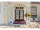 Inviting front entrance featuring double doors, decorative stone, and a cozy seating area at 15428 Atwater Dr, Brooksville, FL 34604