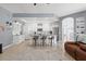 Bright, modern kitchen featuring white cabinetry, stainless steel appliances, and granite countertops at 15428 Atwater Dr, Brooksville, FL 34604