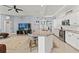 Modern kitchen featuring granite countertops, seating at the island and open to the living area at 15428 Atwater Dr, Brooksville, FL 34604