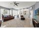 Large living area with plush seating, built-in shelving, and natural light, creating a cozy atmosphere at 15428 Atwater Dr, Brooksville, FL 34604