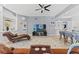 Comfortable living area features a chaise lounge, built-in display shelves, and modern decor at 15428 Atwater Dr, Brooksville, FL 34604