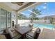 Relaxing screened-in pool area featuring outdoor seating, perfect for entertaining, and overlooking a refreshing swimming pool at 15428 Atwater Dr, Brooksville, FL 34604