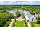 Aerial view showcasing the clubhouse, lush landscaping, and resort-style pool of the community at 15635 Starling Water, Lithia, FL 33547