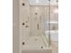 Modern bathroom with a glass-enclosed shower, soaking tub, and elegant fixtures at 15635 Starling Water, Lithia, FL 33547