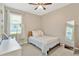 Cozy bedroom featuring a full bed, natural light, and a desk area, perfect for a room at 15635 Starling Water, Lithia, FL 33547