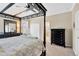 A well-lit main bedroom with a four-poster bed, neutral walls, and closet and bathroom access at 15635 Starling Water, Lithia, FL 33547