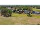 Scenic aerial view of homes backing onto a lush golf course with private pools at 16503 W Course Dr, Tampa, FL 33624