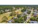 Aerial view of homes overlooking a scenic golf course, surrounded by lush greenery and mature trees at 16503 W Course Dr, Tampa, FL 33624
