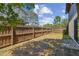 The backyard features a sturdy wooden fence, providing privacy and security for outdoor activities at 16503 W Course Dr, Tampa, FL 33624