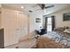 Comfortable bedroom features a large closet and adjacent desk and window area for work or play at 16503 W Course Dr, Tampa, FL 33624