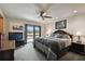This bedroom features a sliding glass door to a balcony, a comfortable bed, and two nightstands at 16503 W Course Dr, Tampa, FL 33624