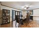 Traditional dining room features a bookcase, stylish furnishings, and a ceiling fan at 16503 W Course Dr, Tampa, FL 33624