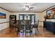 Traditional dining room with wood floors, wainscoting, and French doors leading to the outside at 16503 W Course Dr, Tampa, FL 33624