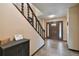 Traditional foyer featuring a staircase, tiled flooring and a decorative front door at 16503 W Course Dr, Tampa, FL 33624