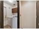 Functional laundry room with modern washer and dryer, convenient for everyday living at 16503 W Course Dr, Tampa, FL 33624