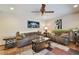 Inviting living room features comfortable seating, stylish decor, and a ceiling fan for a cozy atmosphere at 16503 W Course Dr, Tampa, FL 33624