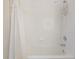 White tiled bathtub and shower combination with white curtain at 18013 Palm Breeze Dr, Tampa, FL 33647