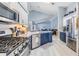 Kitchen featuring granite countertops, modern stainless steel appliances, and luxury vinyl plank flooring at 18013 Palm Breeze Dr, Tampa, FL 33647