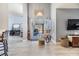 Sitting area with tile floors leading to a sliding glass door and outdoor patio at 18013 Palm Breeze Dr, Tampa, FL 33647
