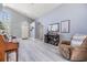 Spacious living room with wood floors and large windows offering plenty of natural light at 18013 Palm Breeze Dr, Tampa, FL 33647