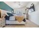 Bright main bedroom with a king-size bed, high ceilings, large windows, and ample closet space at 18013 Palm Breeze Dr, Tampa, FL 33647